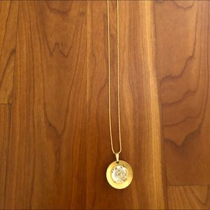 Pendant watch on gold chain